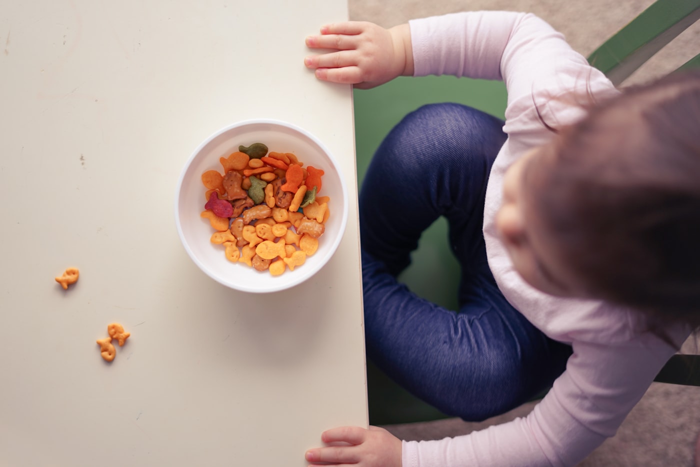 Children sharing snack time at a pre-school table